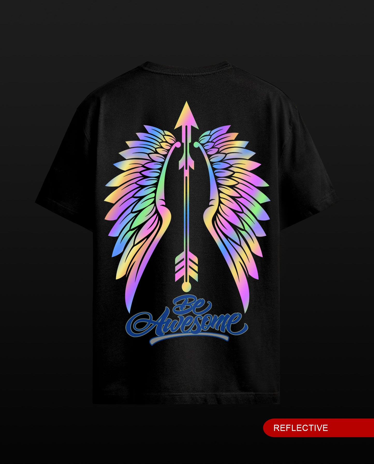 A black short-sleeve t-shirt shown from the back, featuring a large graphic of colorful reflective rainbow wings with a central arrow and the text 'Be Awesome' in blue. A red label in the bottom right corner reads 'REFLECTIVE'.