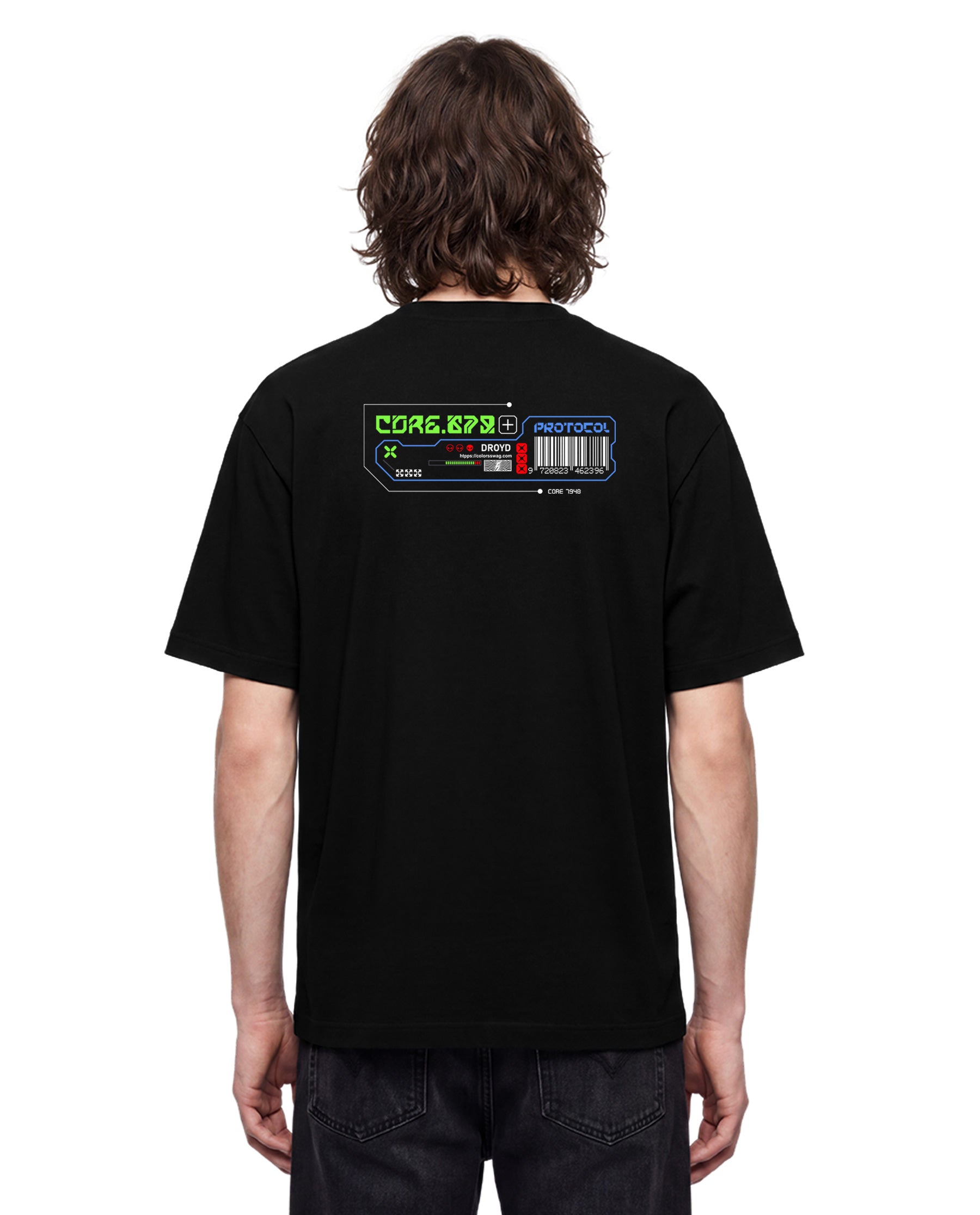 A man viewed from behind wearing a black t-shirt with a colorful retro computer terminal graphic on the upper back, paired with dark jeans against a plain white background.