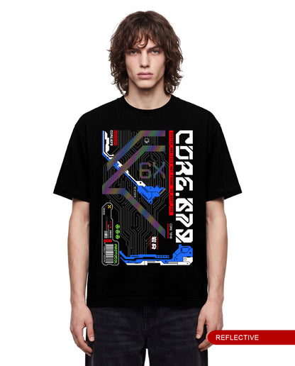 A model wearing a black short-sleeve t-shirt with a large futuristic graphic print on the front. The graphic features circuit board patterns, holographic elements, and stylized text including 'CORE 622' and 'REFLECTIVE'.